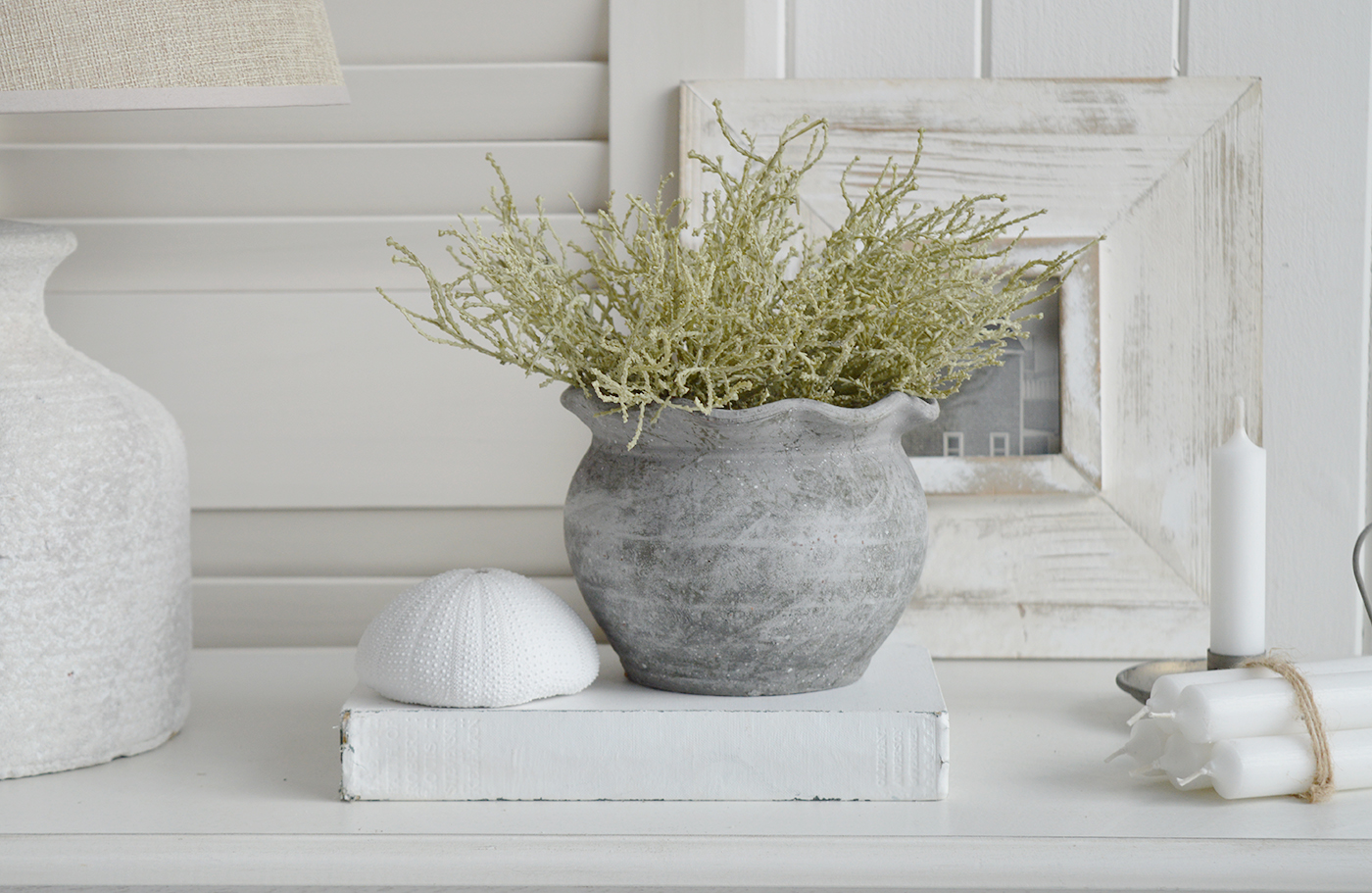 The Meredith stone pots, a grey pot iwht a fluted top to stel your coastal inspired home New England style