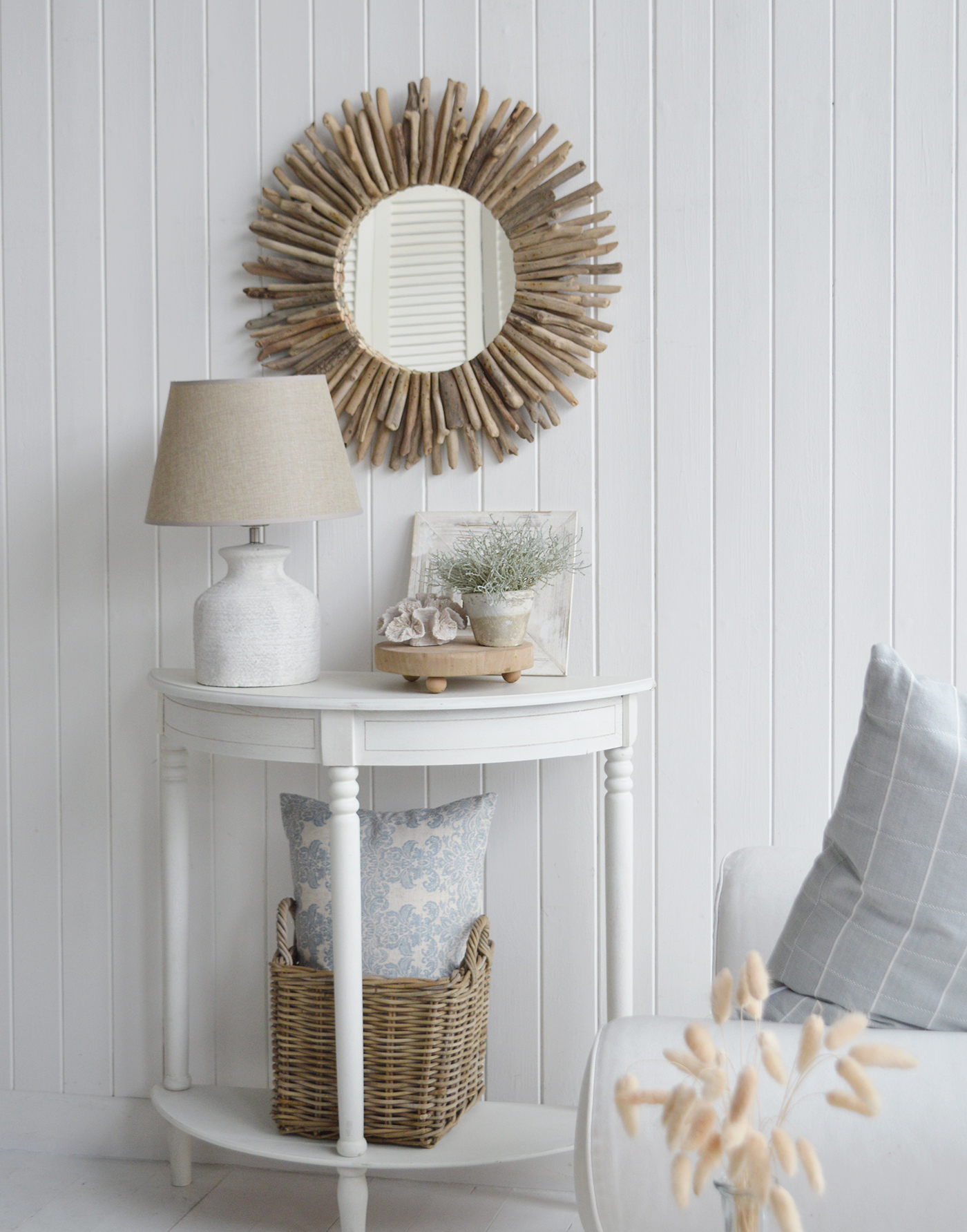 Coastal mirror crafted from driftwood pieces to complement our Beach house style New England furniture, shown here above the white Cape Ann console table