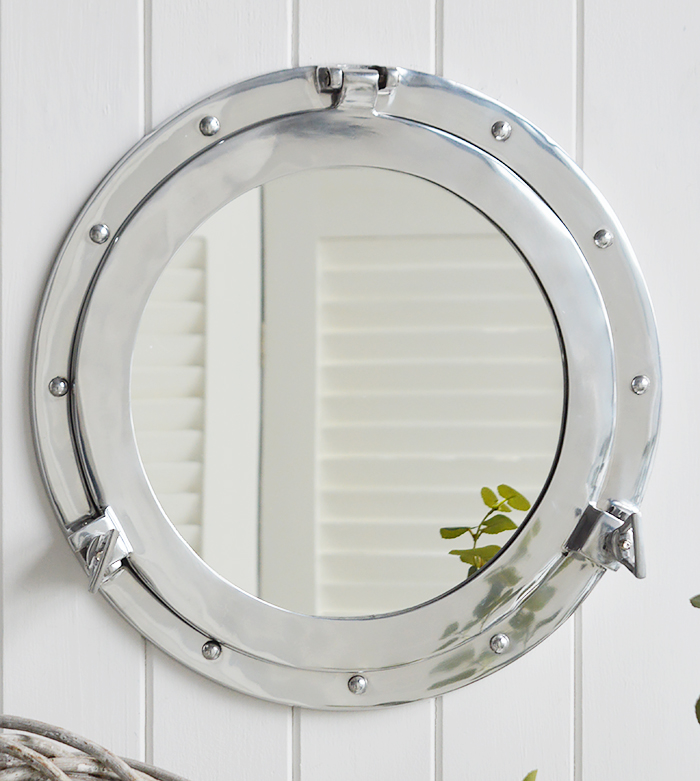 Silver porthole nautical mirror for coastal inspired interiors