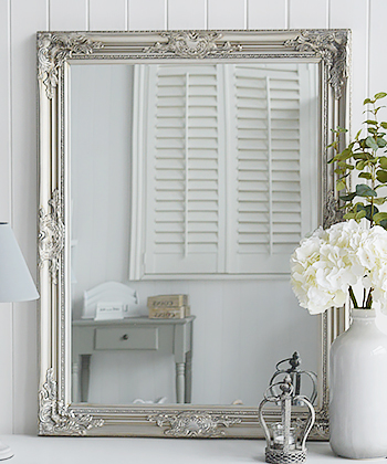 Large silver wall mirror with ornate chunky frame. Can be hung landscape or portrait