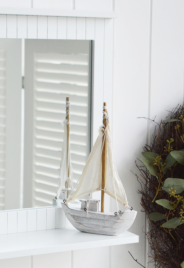 White bathroom mirror with a shelf for coastal bathroom decor