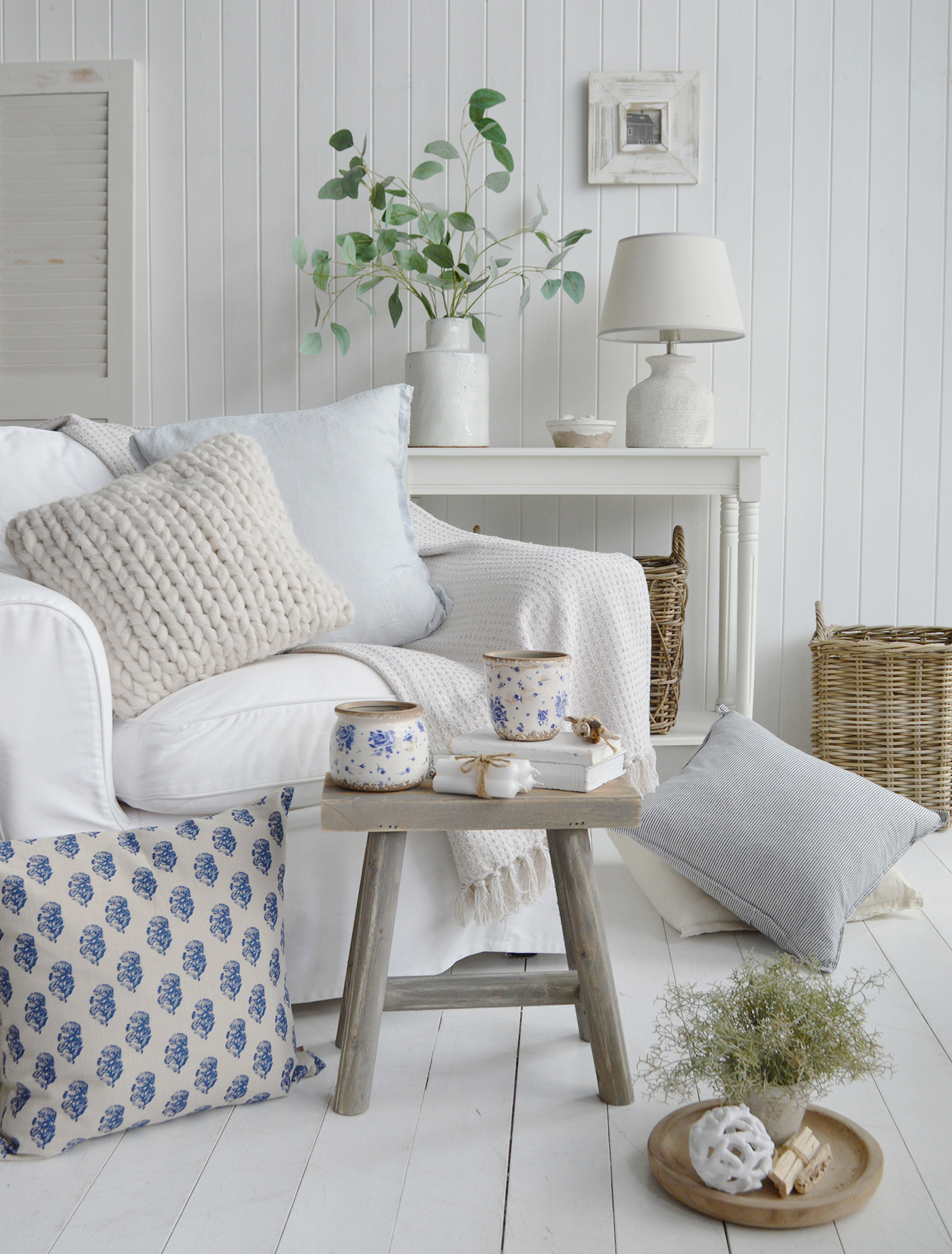 Striped linens and simple pottery add softness without stealing the show.