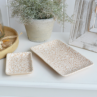     Create beautifully layered coastal styling by pairing a decorative trinket dish with candles, coral, books and natural accessories.