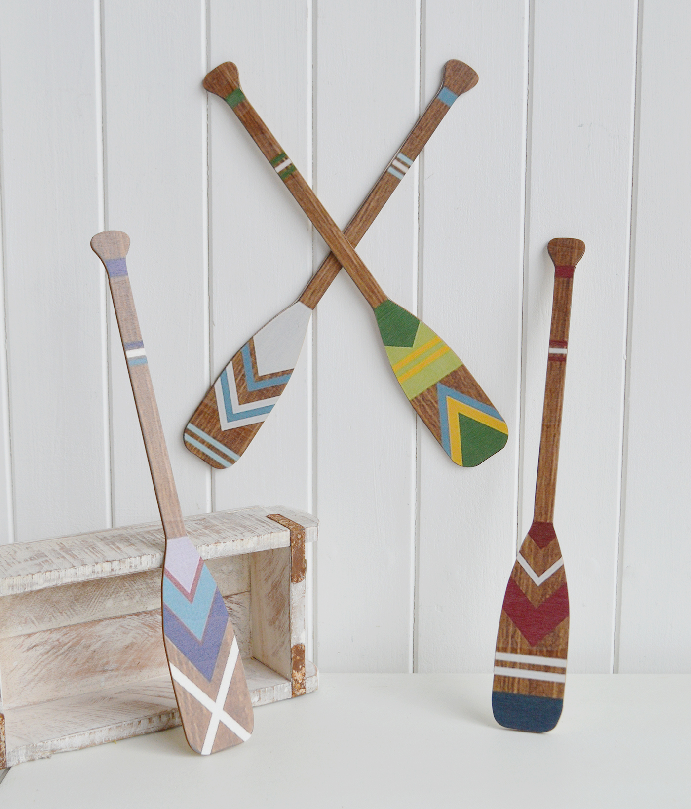 Bring timeless coastal decor into your home with this beautiful set of four decorative wooden wall paddles.