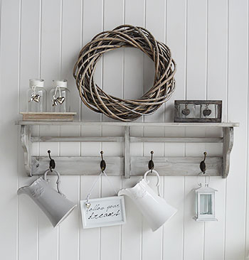 Driftwood shelf unit with hooks for a coastal bathroom for hanging towels