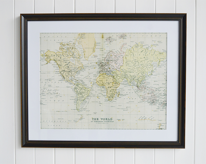 framed print of The World on Mercators Projection by J. Barthholomew P.R.G.S in a vintaged black frame with a thick white mount.