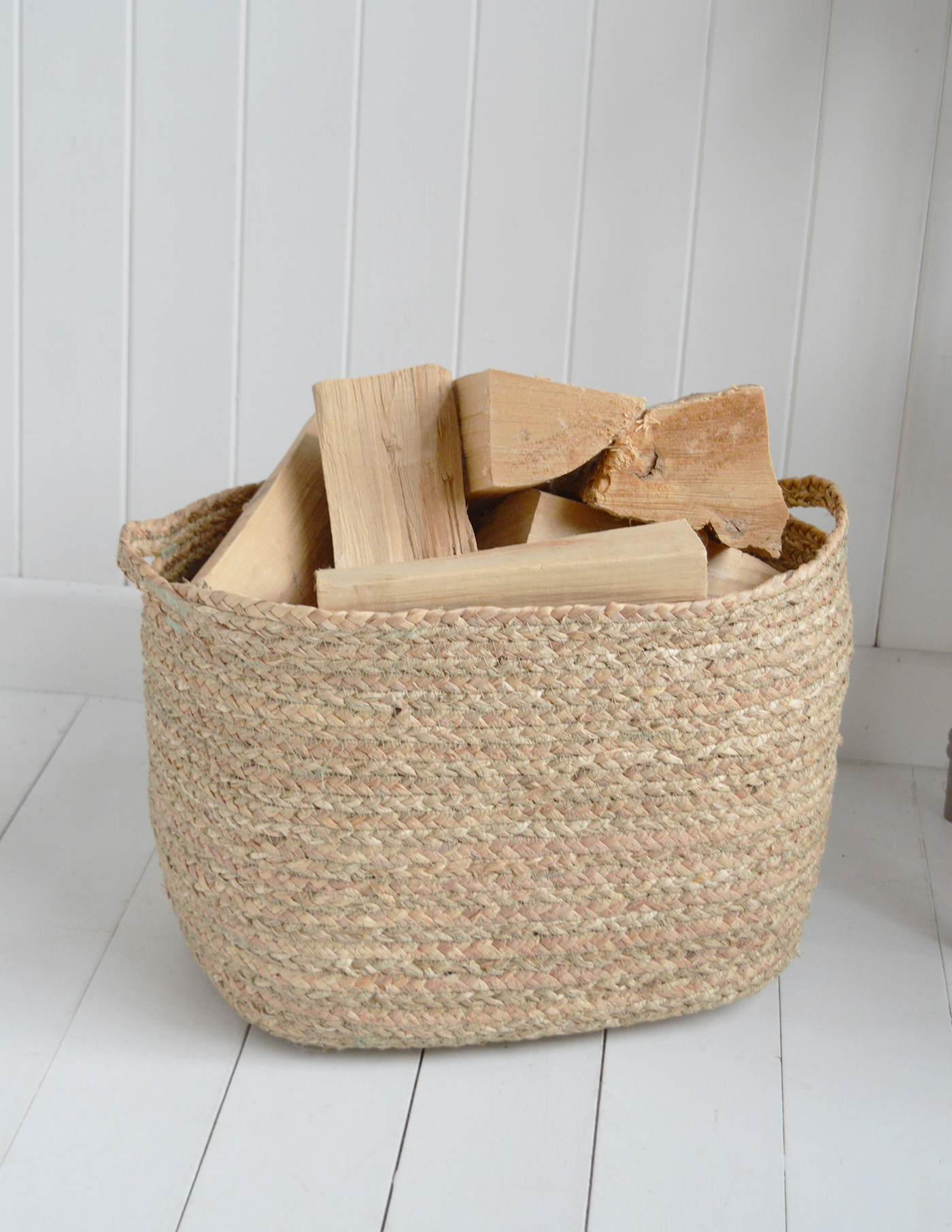 With its softly rounded shape, woven texture and neutral tones, the Princeton log basket keeps firewood neatly stored while adding warmth to New England and modern-country interiors.