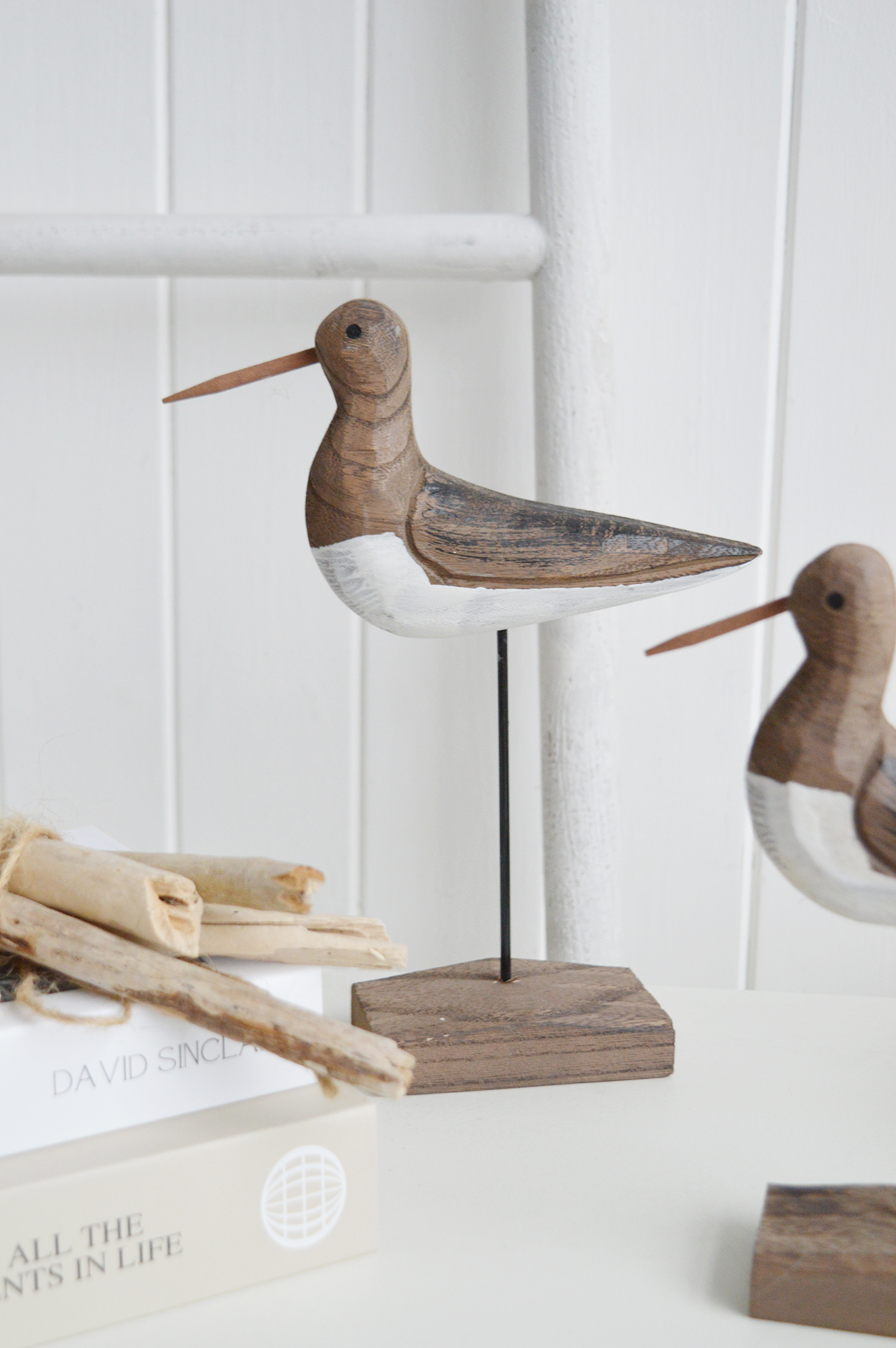 Their natural wood tones complement neutral, beach-house inspired spaces beautifully