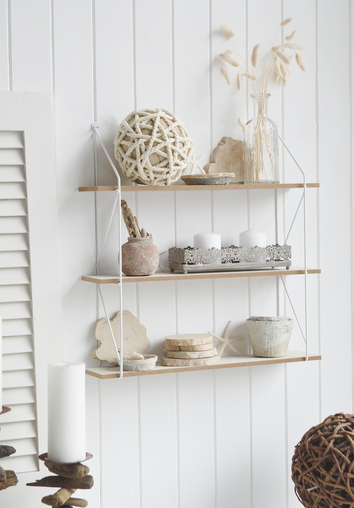 Boston Bohemian Industrial Wall Shelf with 2 shelves. Pitcure shown in a living room with books, photo frames and a clock for wall decor