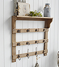 Pawtucket wooden wall shelf with hooks in greyed wood for the living room, bathroom, hallway or bedroom. Perfectly complements coastal, country and white furniture in New England Interiors and homes from The White Lighthouse