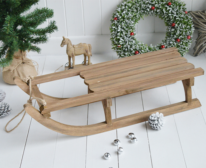 A gorgeous decorative wooden sleigh for elegant Christmas decorations