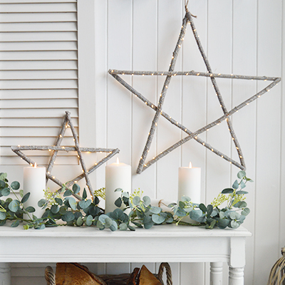 The White Lighthouse. White Furniture and accessories for the home. LED Light up wooden stars hanging New England interiors for coastal, country, and modern farmhouse homes for Christmas decor