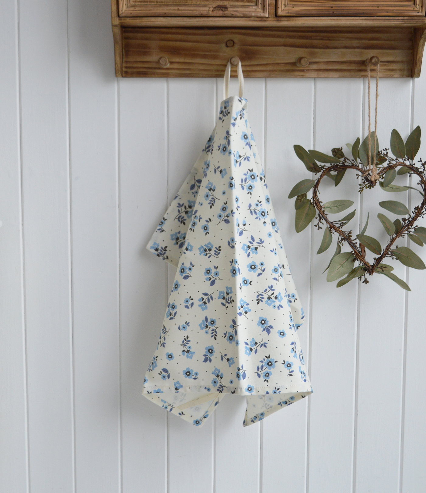 A close up of the coastal cottage florals in the tea towel