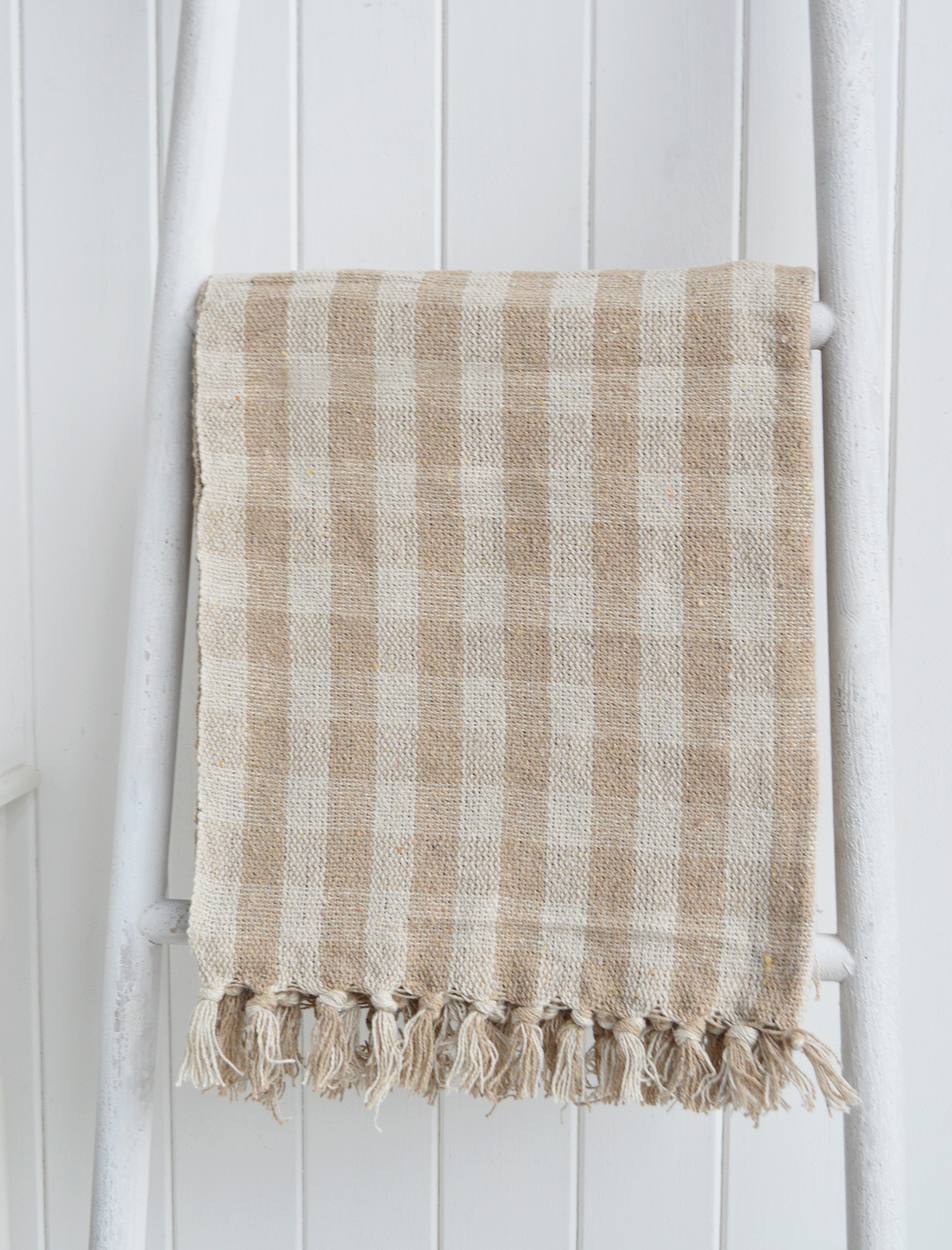 Style your home with the Stowe Sand Check Throw, a beautifully woven coastal throw that adds warmth and texture to any neutral interior.