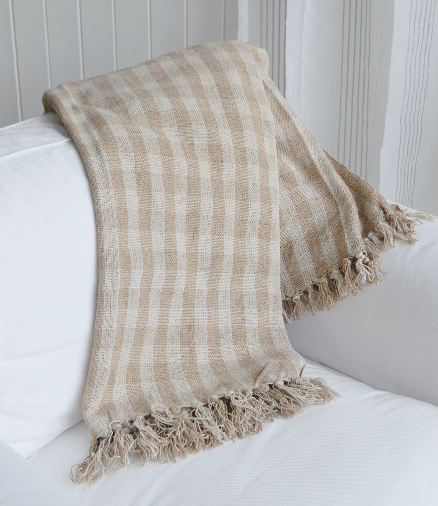 Bring effortless style to your living space with this versatile checked throw blanket, ideal for creating cosy modern coastal interiors all year round.