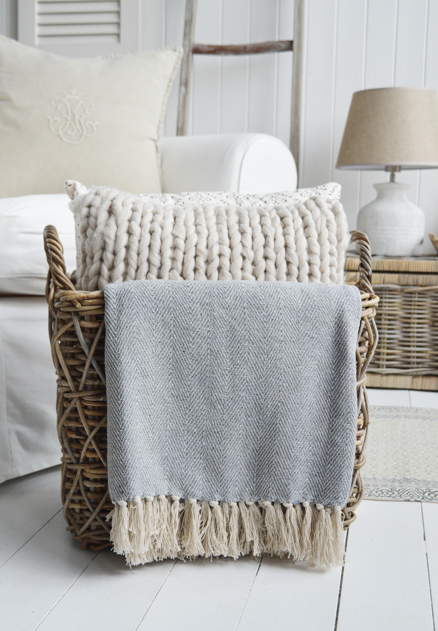 Stowe throws in blues, greys and natural coloures  for interiors in New England styles modern farmhouse, country, coastal and city homes from The White Lighthouse. Furniture and home interiors UK - Pale Grey Herringbone Throw