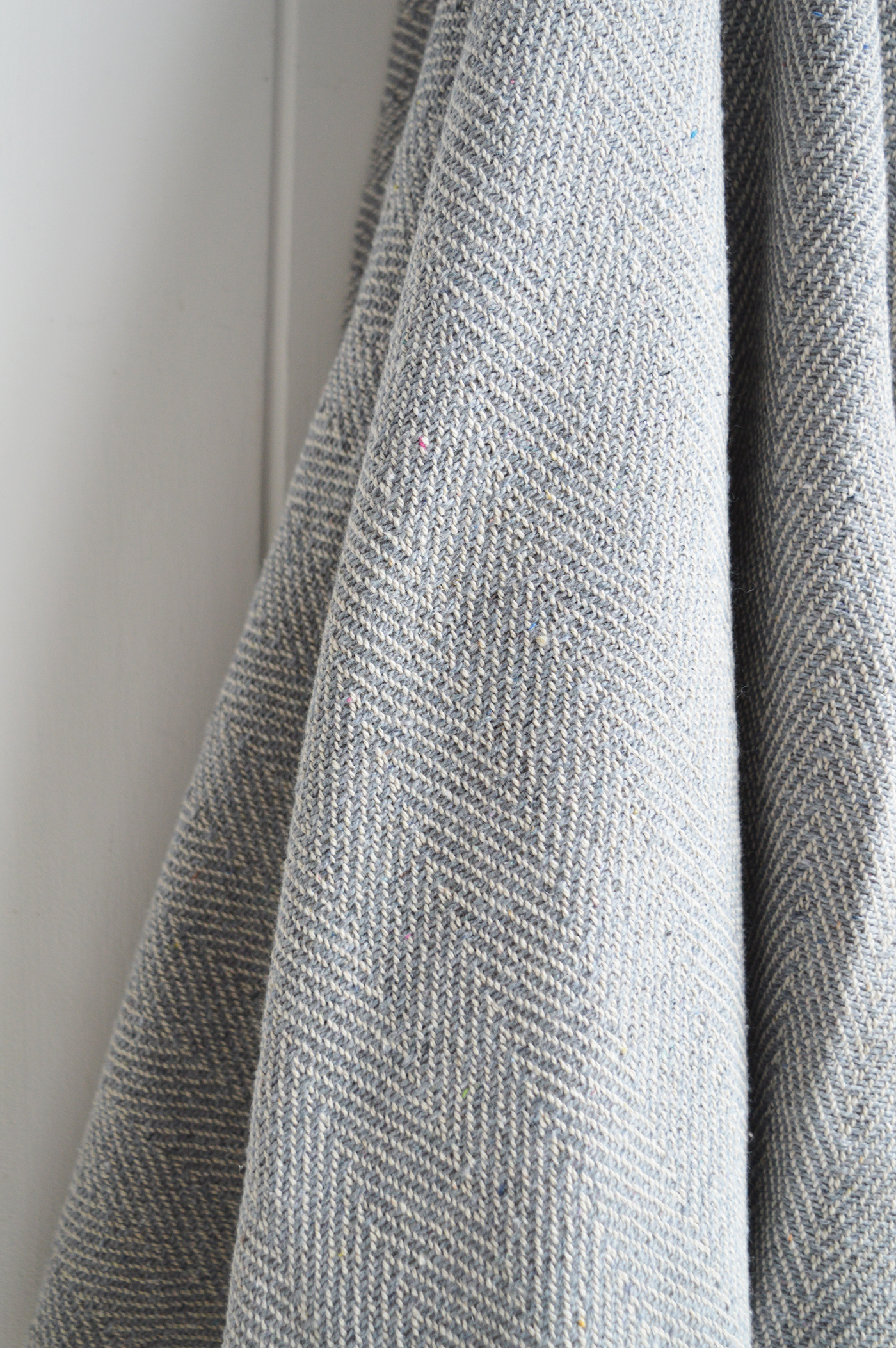Stowe throws in blues, greys and natural coloures  for interiors in New England styles modern farmhouse, country, coastal and city homes from The White Lighthouse. Furniture and home interiors UK - Pale Grey Herringbone Throw