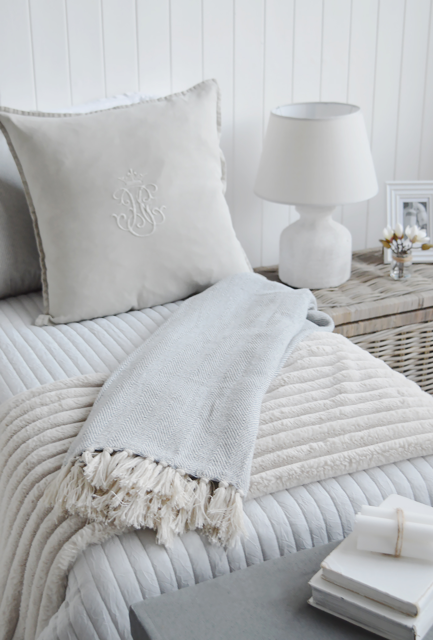 The Stowe grey throw with the Jackson luxury faux fur throws for a neutral setting in a bedroom