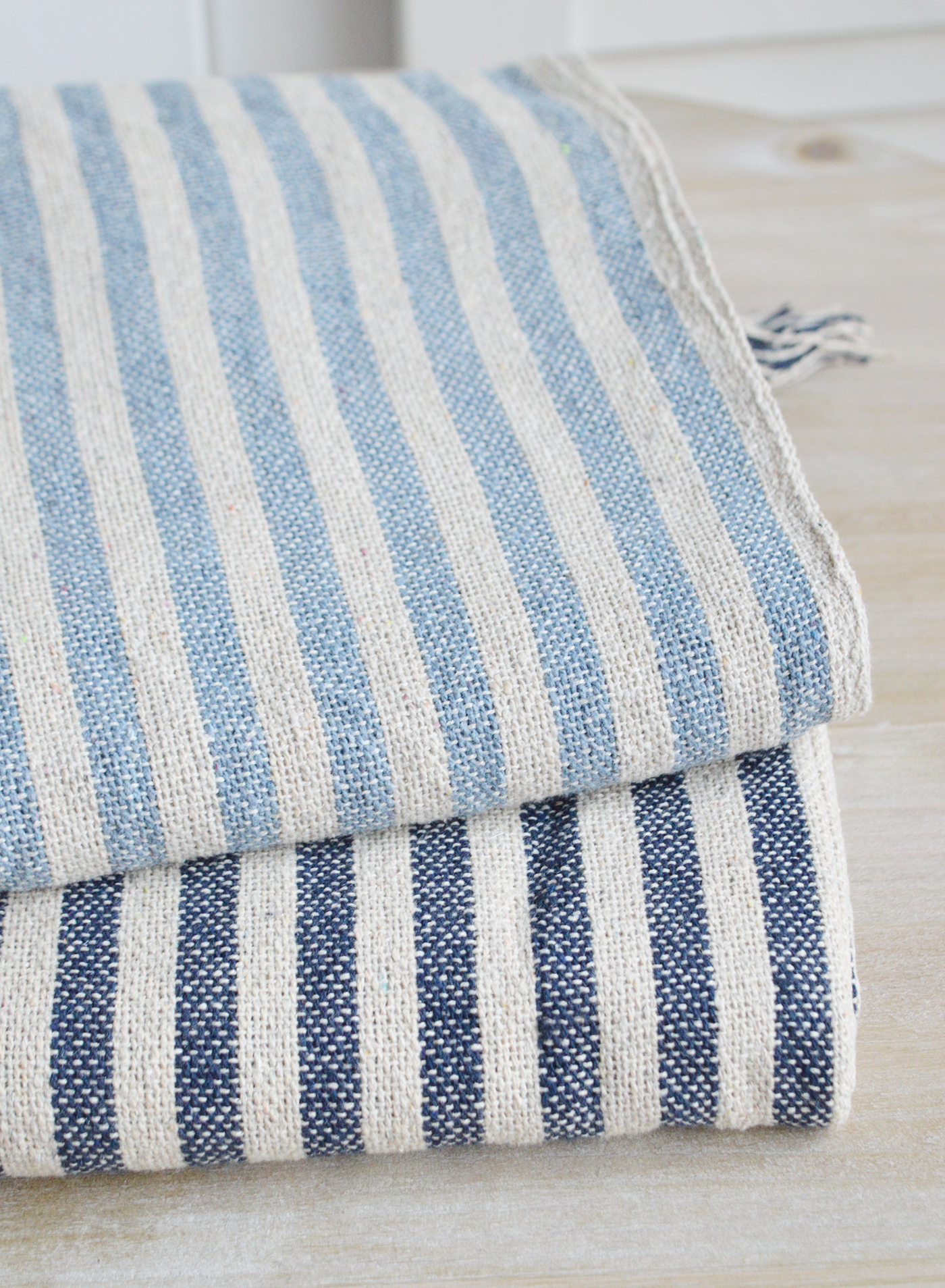 Coastal, country and modern farmhouse interiors and furniture. Navy Blue Mapleton Stripe throws for cosy homes and interiors