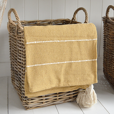 The Pippin throws in sand and sky blue add a soft, relaxed touch to any coastally inspired room.
