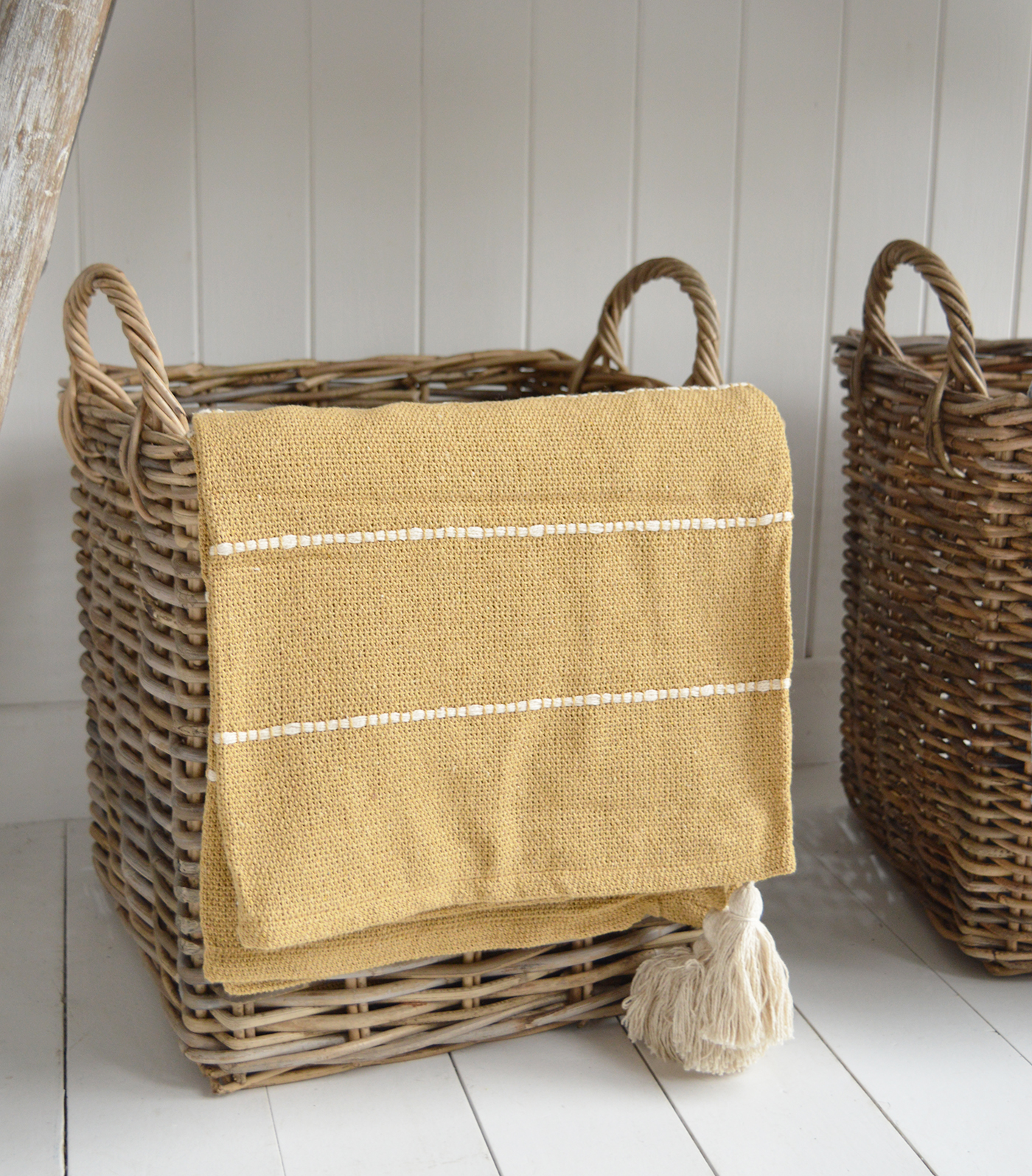 The Pippin throws in sand and sky blue add a soft, relaxed touch to any coastally inspired room.