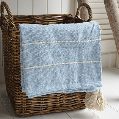 The Pippin throws in sand and sky blue add a soft, relaxed touch to any coastally inspired room.