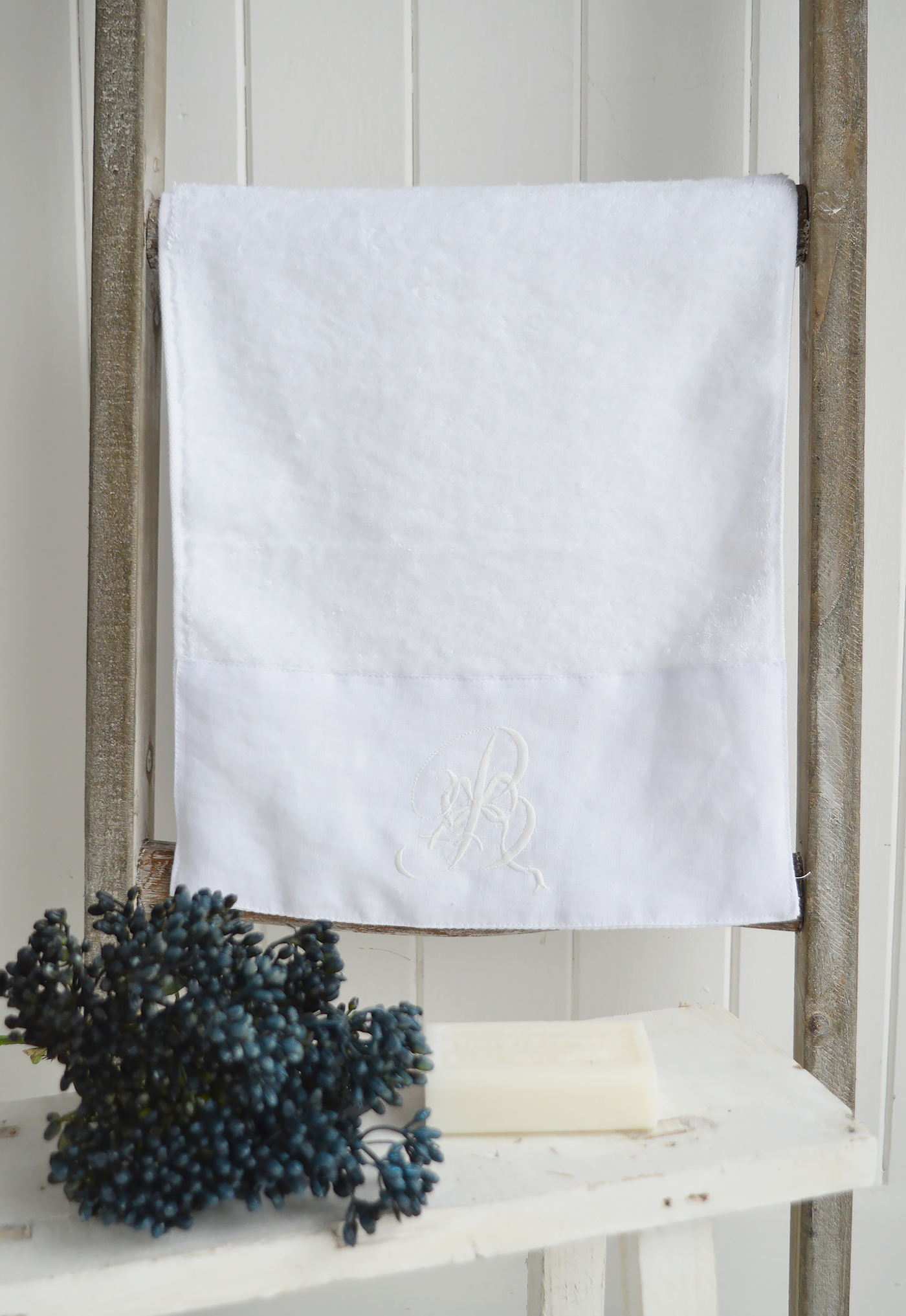 White embroidered guest towel with monogram for beautiful bathrooms