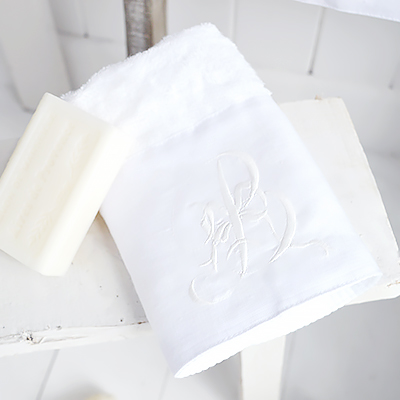 White embroidered guest towel with monogram for beautiful bathrooms