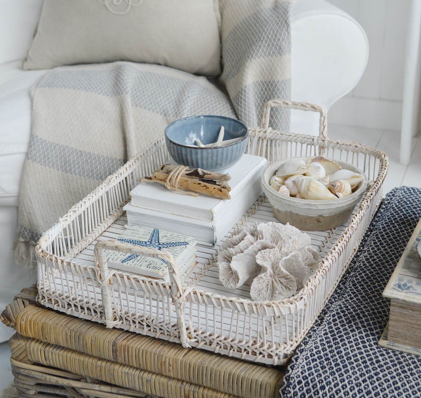 Coastal decor pieces displayed on the putnam tray including faux coral, Pilgrim ceramic bowl, terracotta pot and coastal coasters