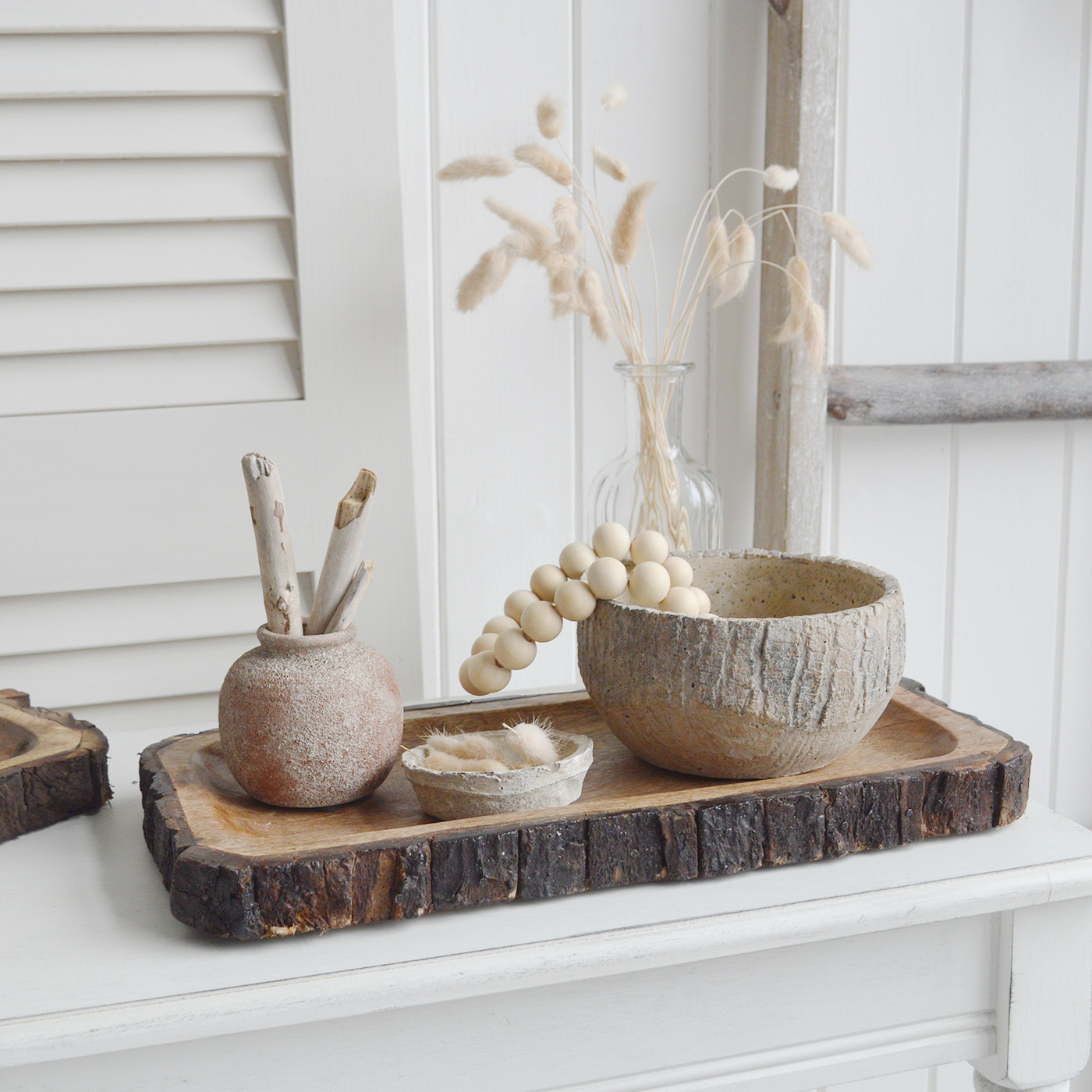 The White Lighthouse. White Furniture and accessories for the home. Natural wooden tree trunk trays for New England interiors for coastal, country, and modern farmhouse homes for coffee table and console table styling