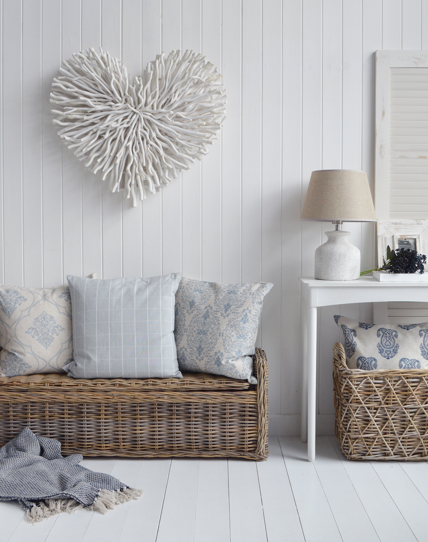 Chunky white twig heart with our Casco Bay baskets and storage seats in a New England style room for coastal and modern farmhouse homes and interiors