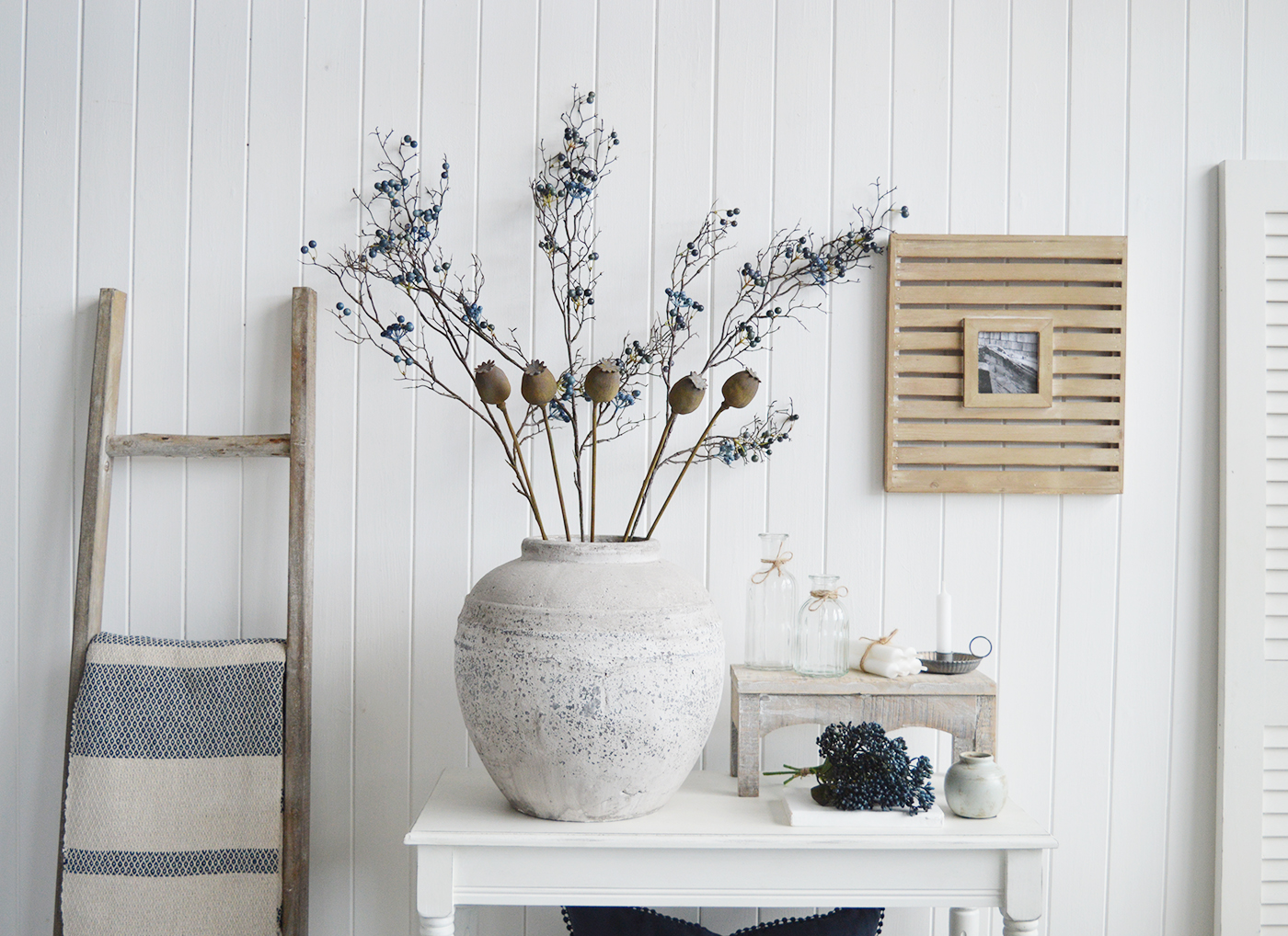 Brockton stone vase with artificial Poppies and Blue Berry Spray