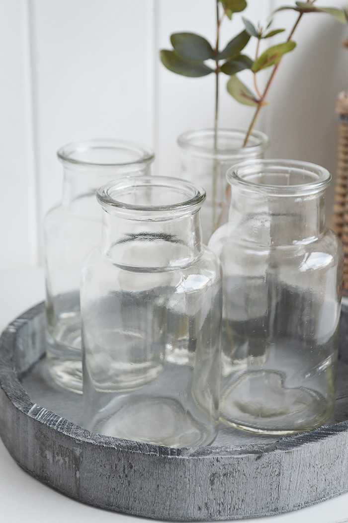 Our minimalist Newbury glass bud jar with artificial Eucalyptus sprig on the grey wooden tray. Perfect for seasonal stems or our artificial Pussy Willow, Eucalyptus or Olive tree sprigs