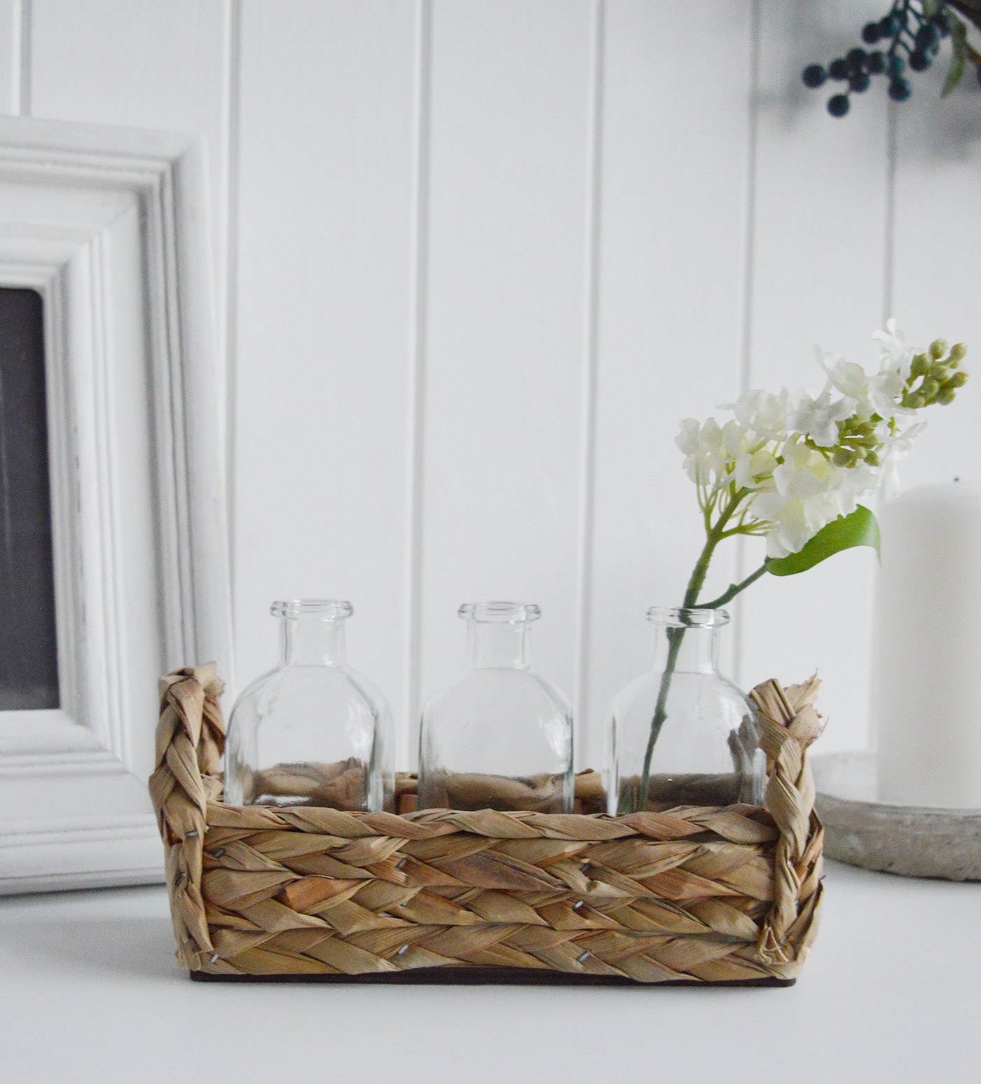 Newbury Small Glass Bud Vase in Straw Basket from The White Lighthouse coastal, New England and country furniture and home decor accessories UK