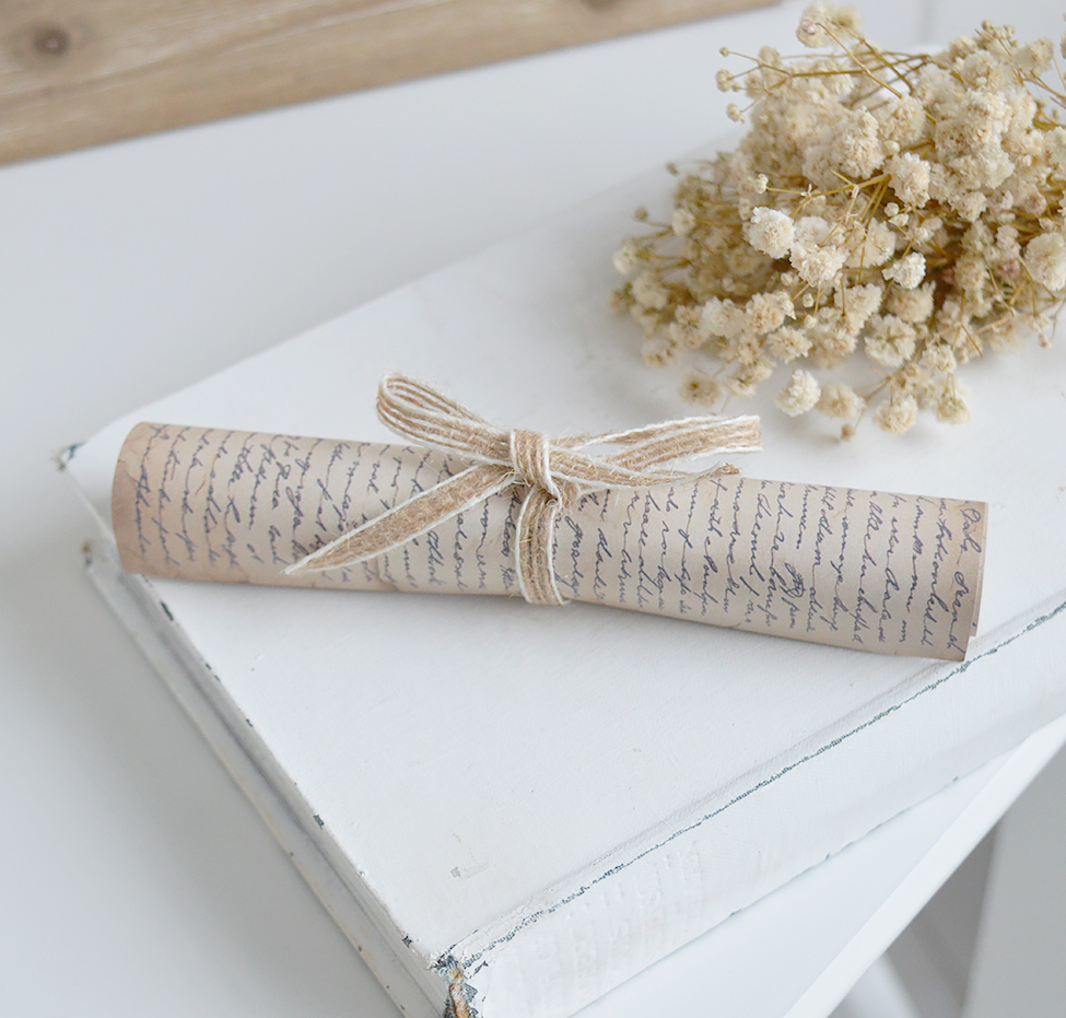 Aged parchment decorative scroll for console table styling in modern country homes.
