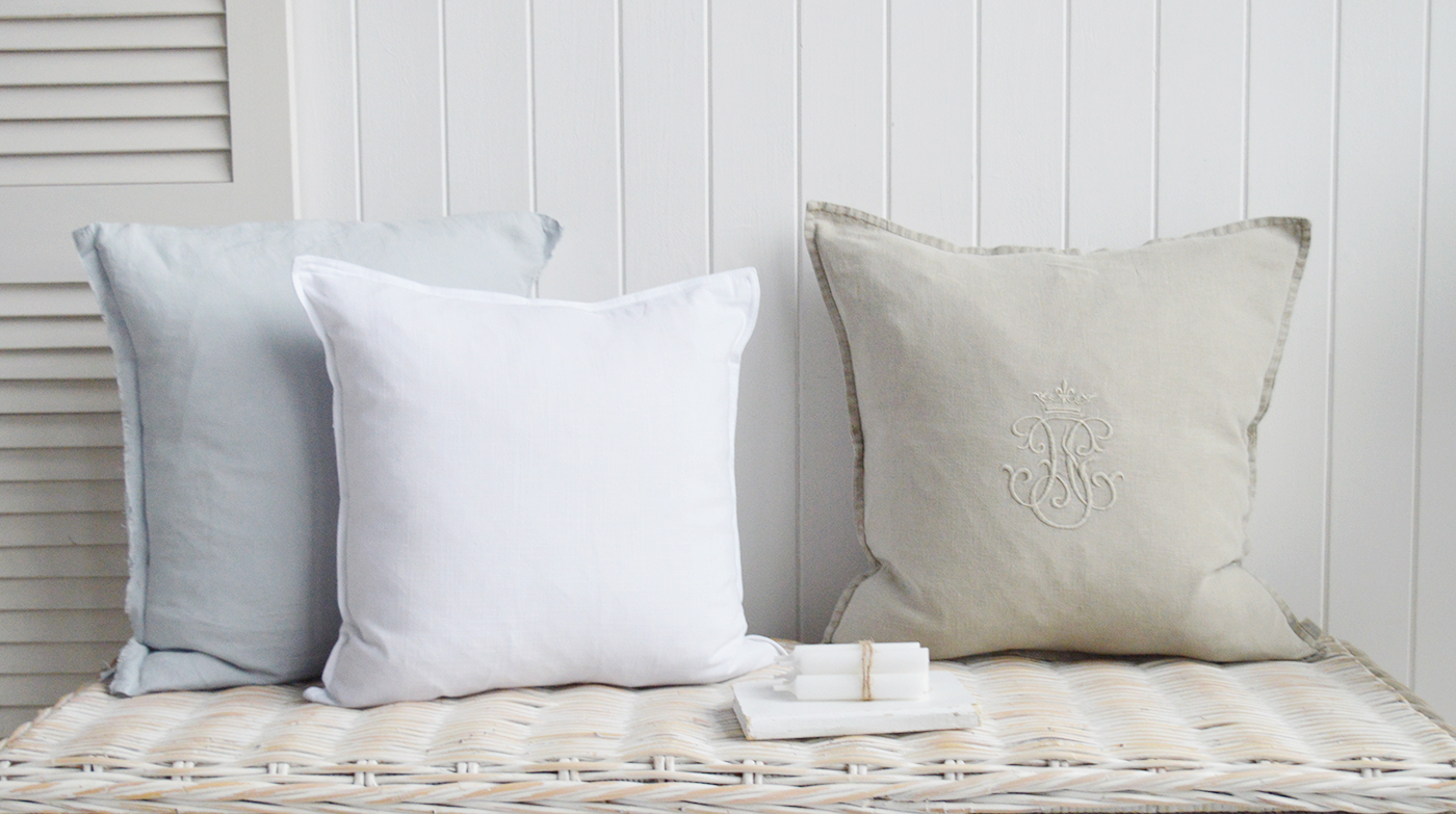 The Hamilton white and pale blue linen cushions with the Richmond linen monogram cushion