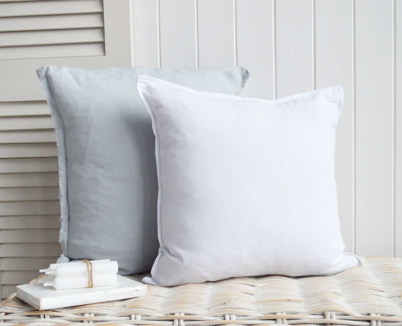 The pale blue and white linen cushion covers for a subtle coastal vibe