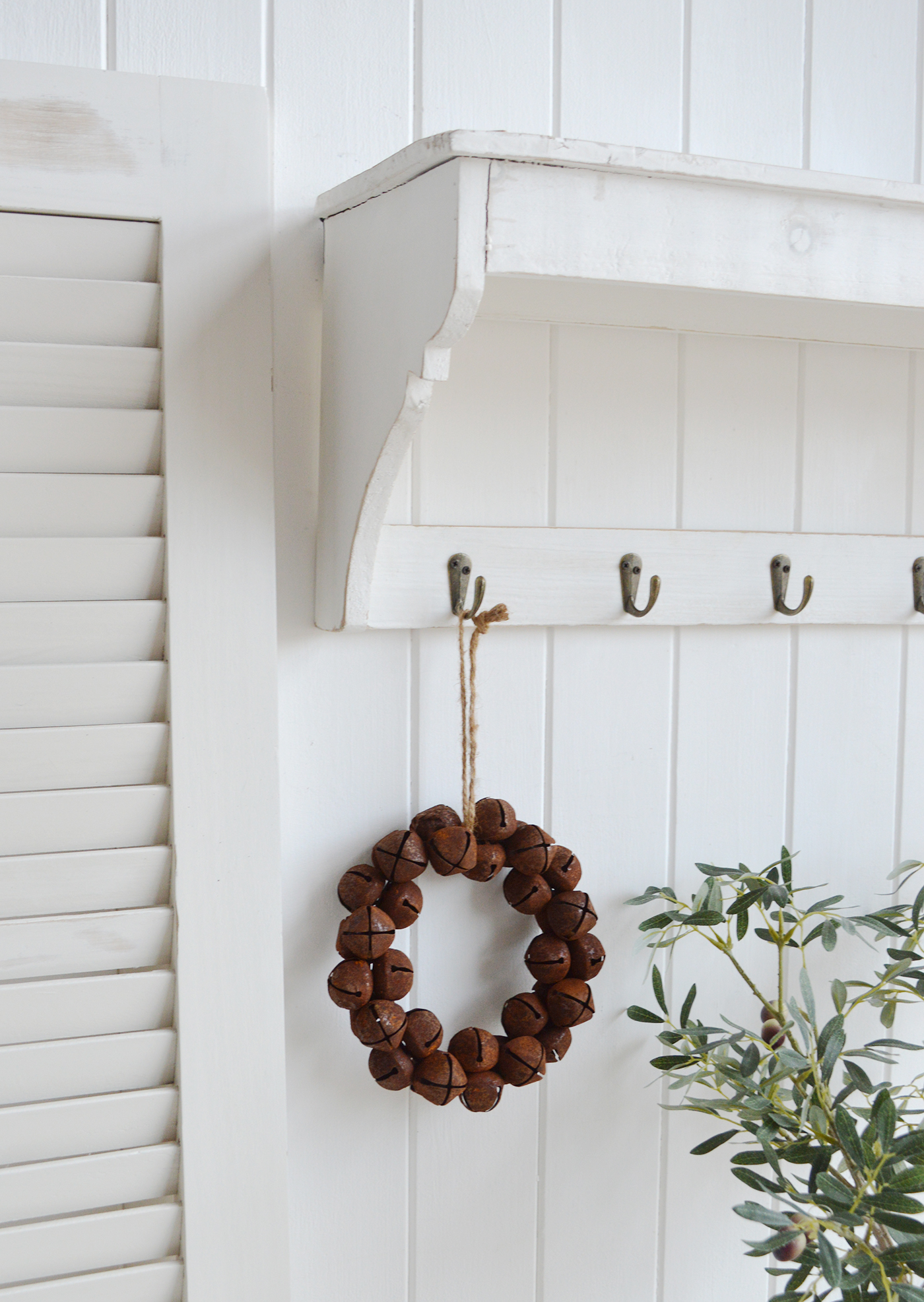 A rusty bell hanging wreath.This is an absolutely beautiful decoration in such a timeless style that will last for many years to comeHang on a peg or door handle for traditional New England farm house decor