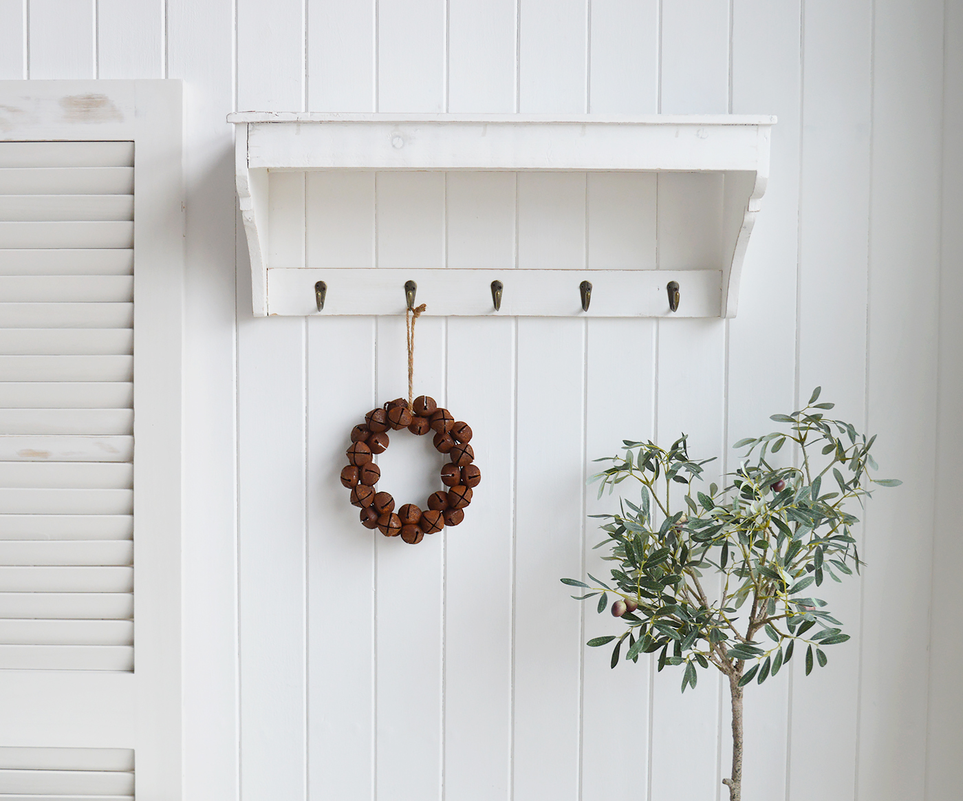 A rusty bell hanging wreath.This is an absolutely beautiful decoration in such a timeless style that will last for many years to comeHang on a peg or door handle for traditional New England farm house decor