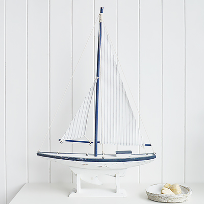 Luxury Chic Coastal nautical decorative accessories for the home by the sea. Small Blue and white yacht