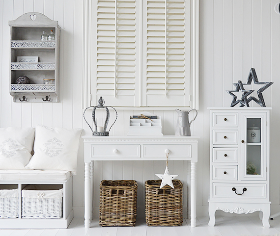 White ahll decor with storage bench, console table and white cabinet. Finished with grey accessories