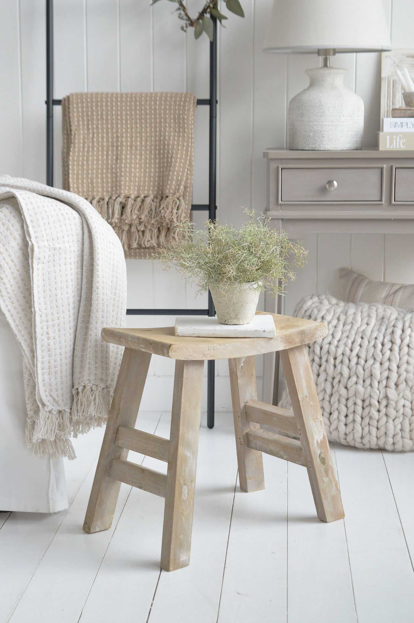 Soft white walls and layered textures are essential to achieving a modern coastal interior.