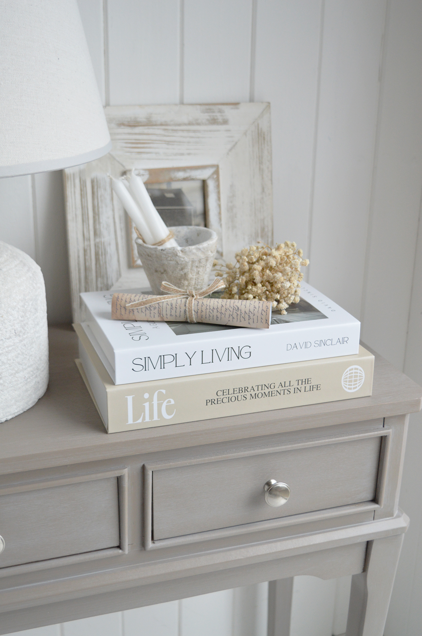 Hamptons inspired neutral decor creates a welcoming space that feels airy, elegant and timeless. Light wood furniture brings balance to soft neutral living rooms.