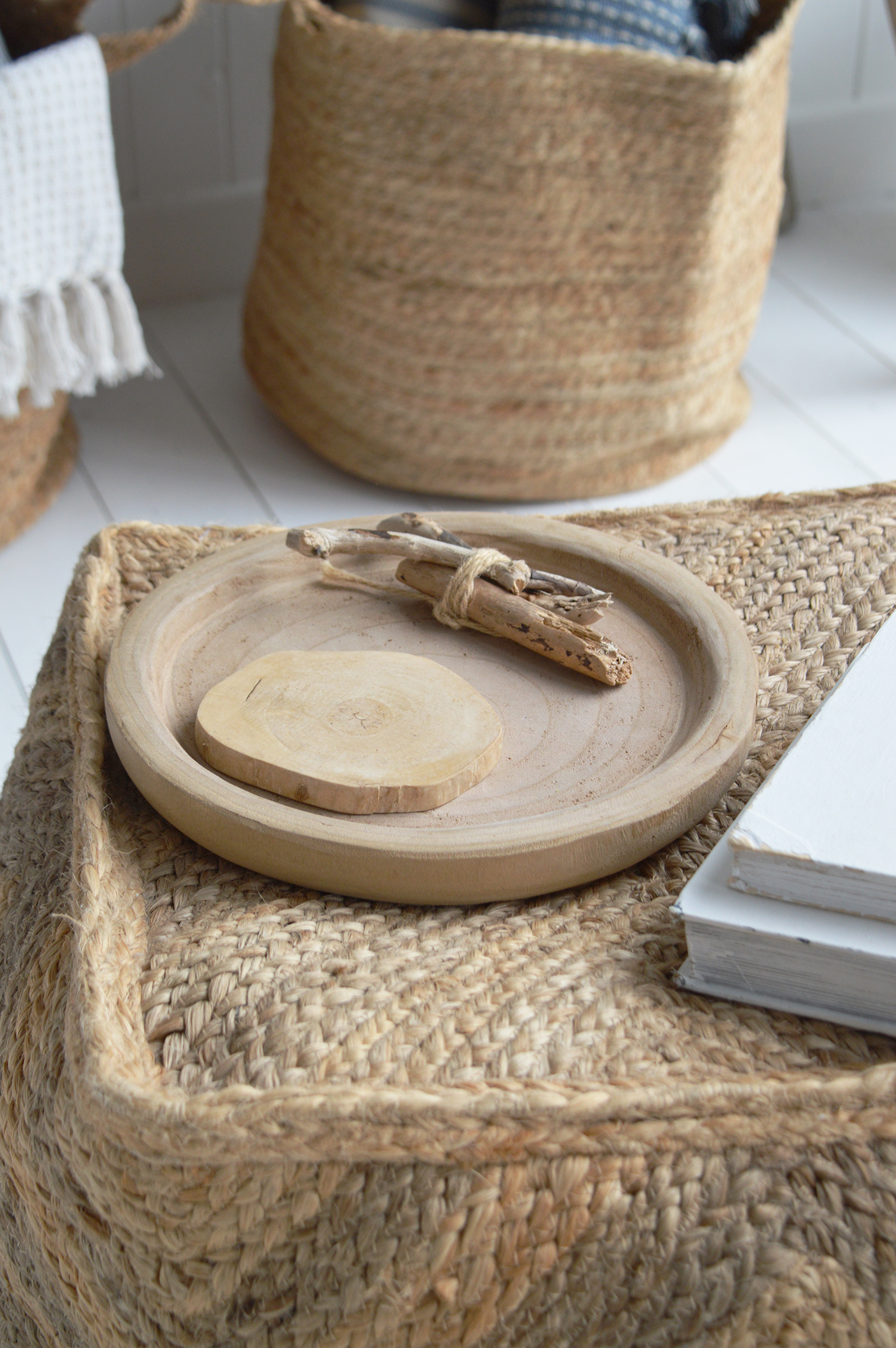 Modern beach house entryway with driftwood-inspired furniture and decor