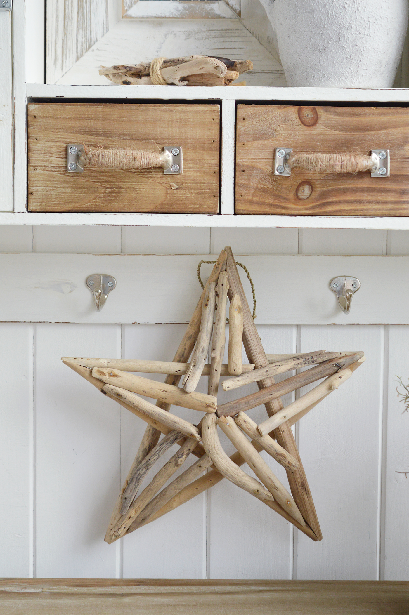 Modern country interiors with rope-handled drawers and driftwood star in coastal chic Hamptons style