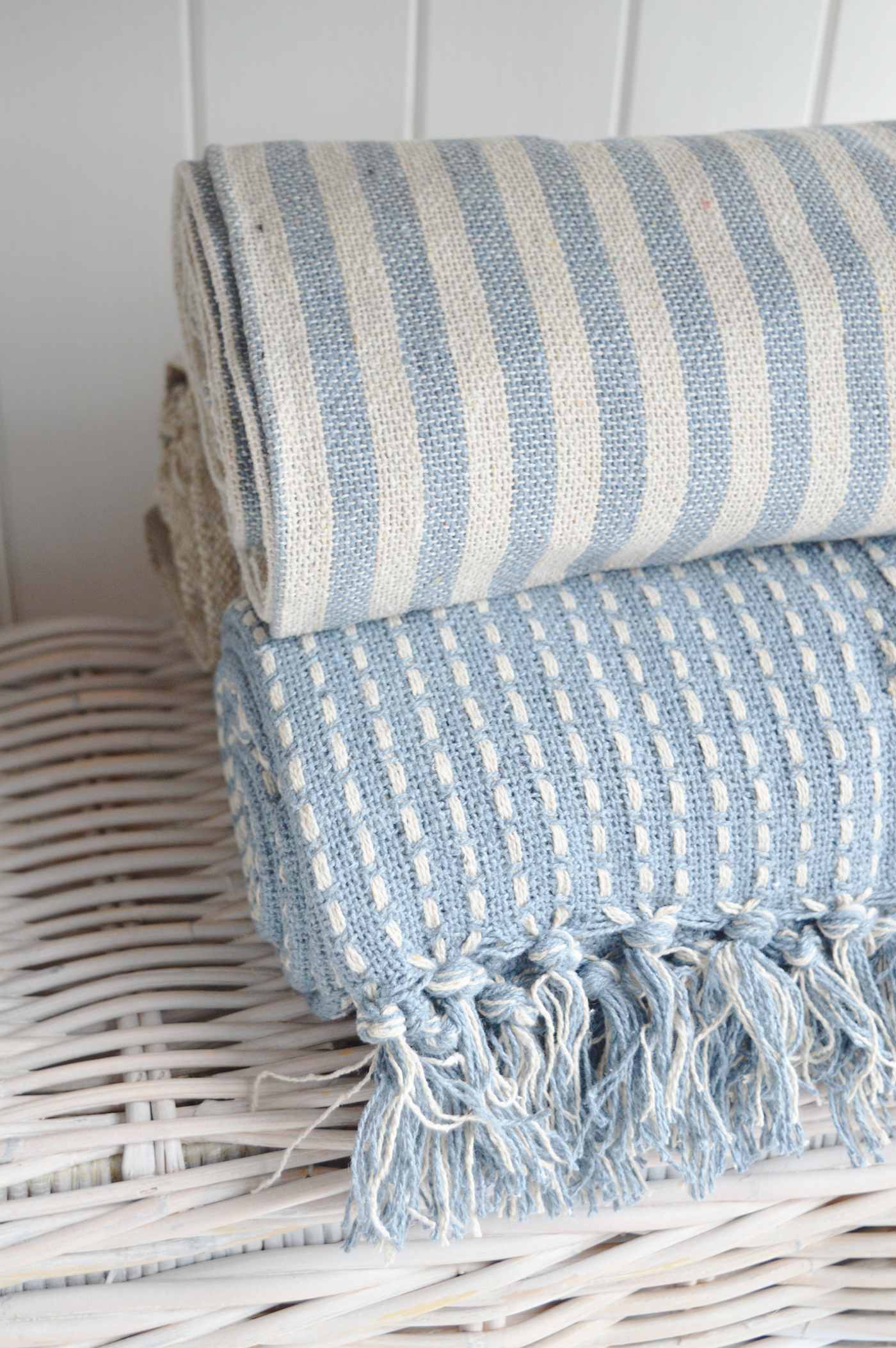 Modern country interiors with woven striped throws in coastal chic Hamptons style.