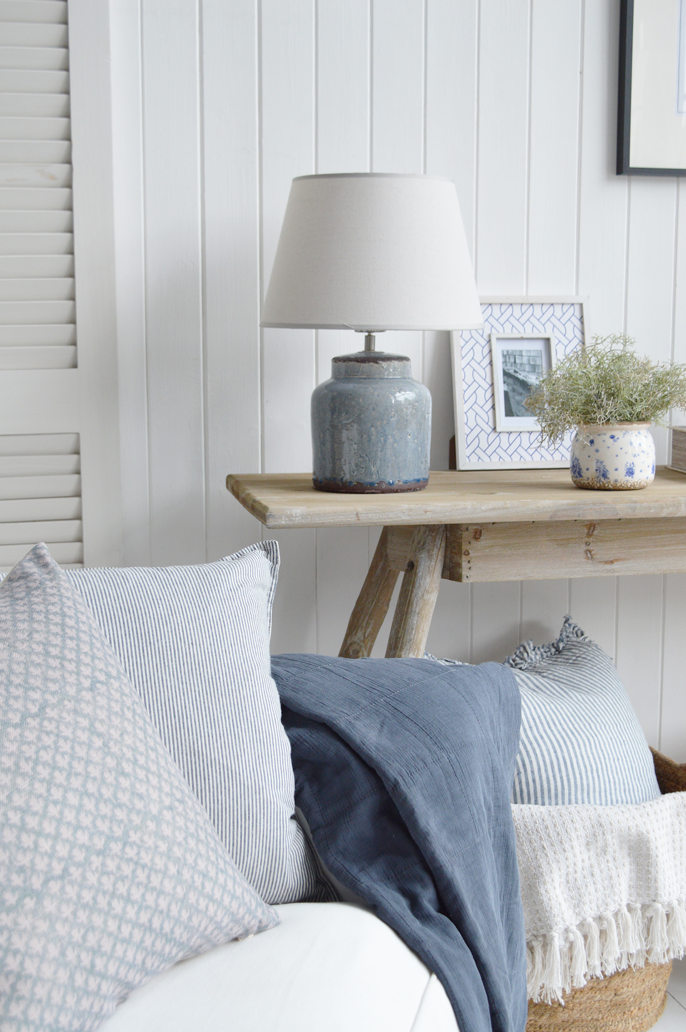 New England beach house interior styled with ocean-inspired blues and neutrals.