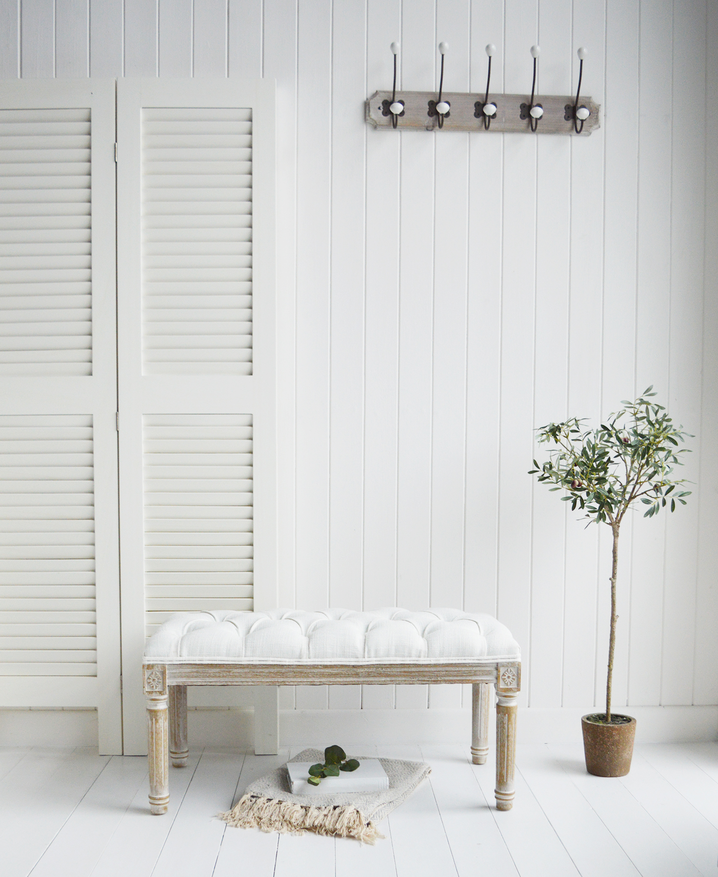 Bench seating in the hallway offers a place to sit and relax