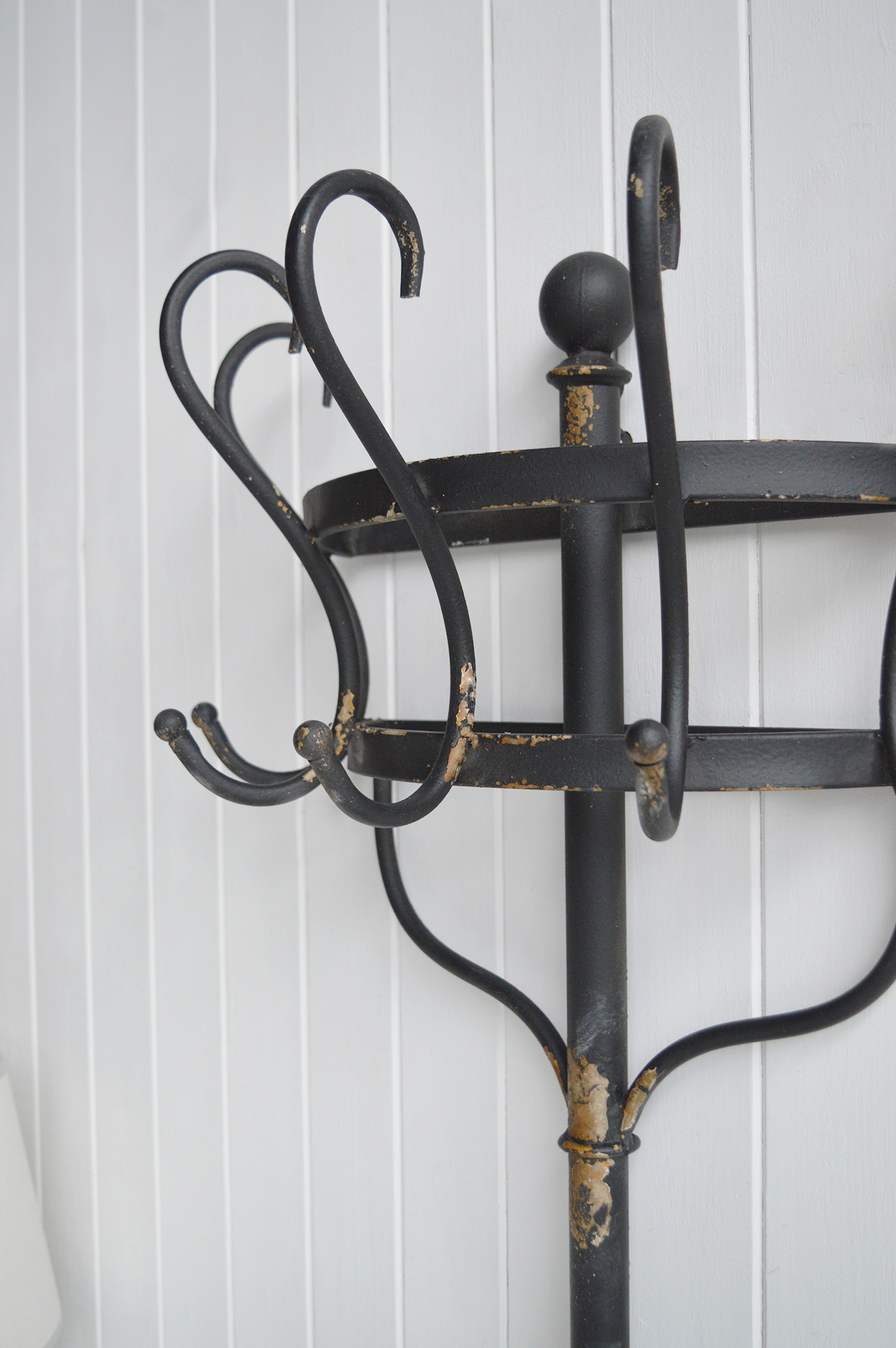 Add stylish hallway storage without taking up valuable floor space with this tall metal wall rack.