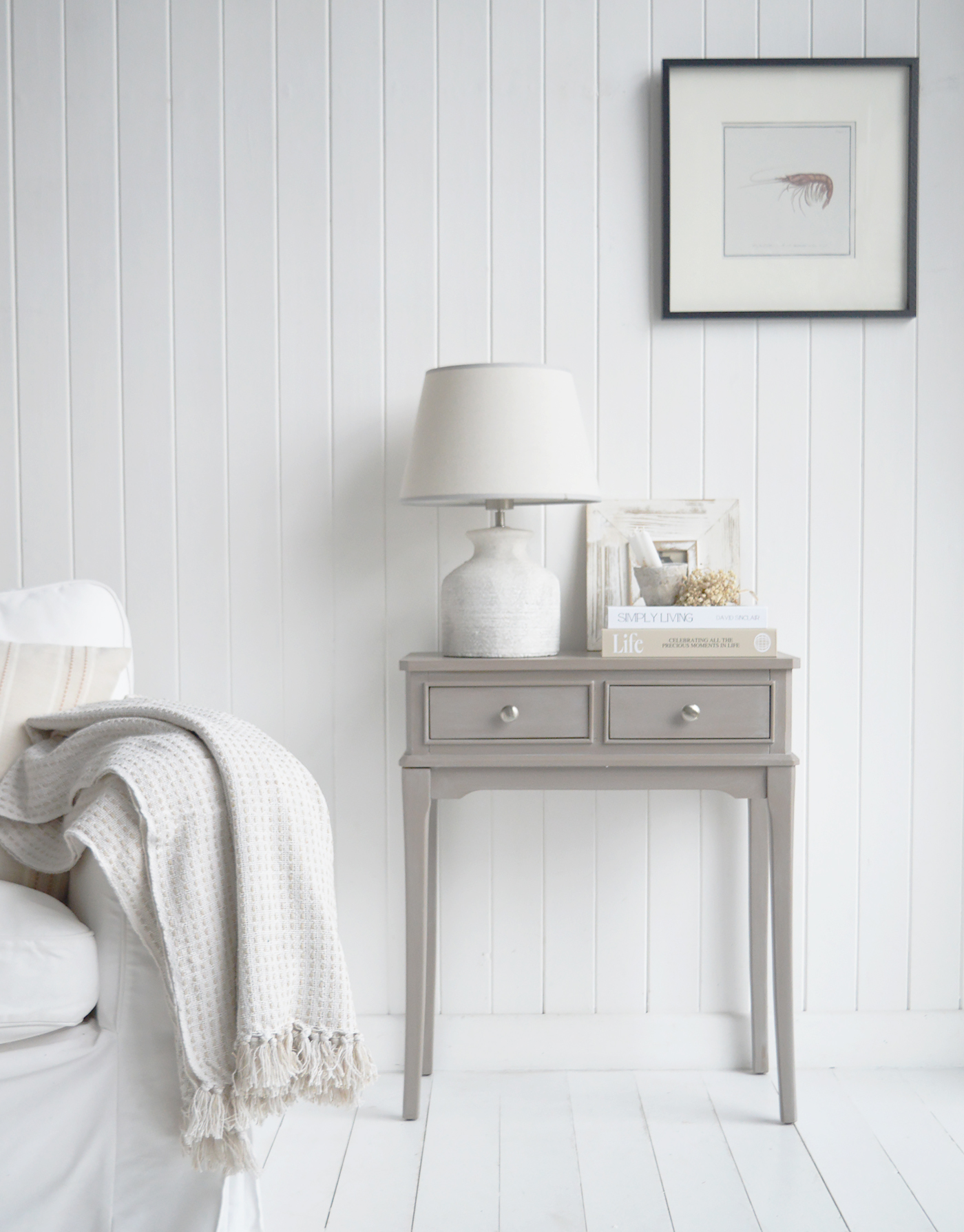 Perfect for hallways or living spaces, this compact two-drawer console table blends seamlessly into New England style interiors and modern country interiors.
